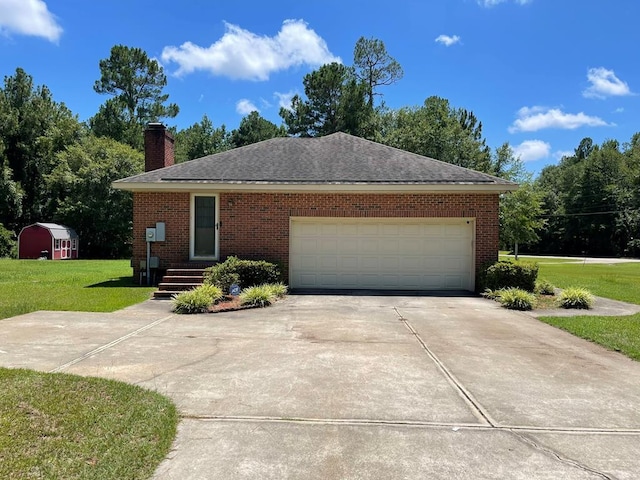 single story home with a garage and a front yard