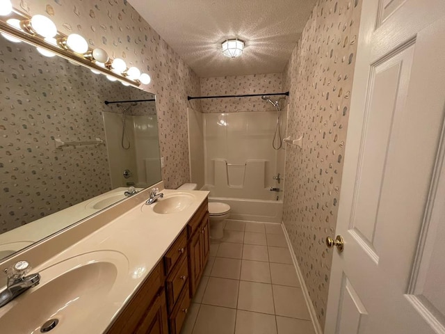 full bathroom featuring vanity, bathtub / shower combination, tile patterned flooring, toilet, and a textured ceiling