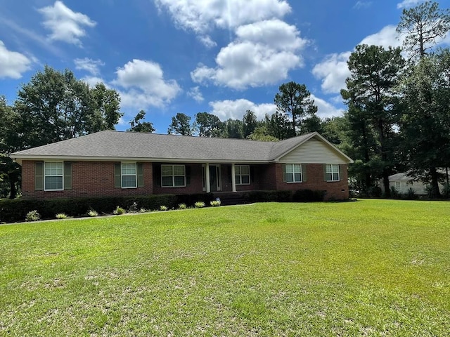 ranch-style home with a front lawn