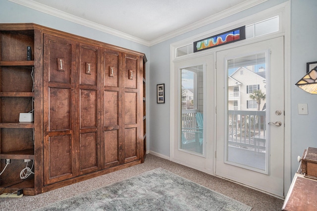 entryway featuring light carpet and crown molding