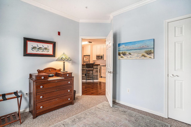 interior space featuring crown molding and carpet floors