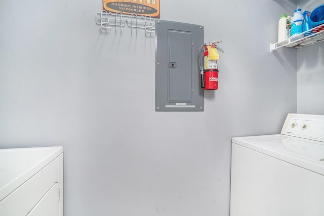 washroom featuring electric panel and washing machine and dryer