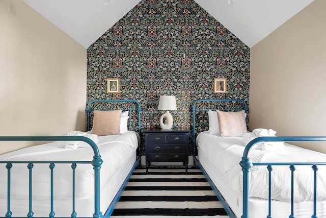 95 Line St, Charleston, SC 29403 - bedroom featuring wallpapered walls, an accent wall, and vaulted ceiling