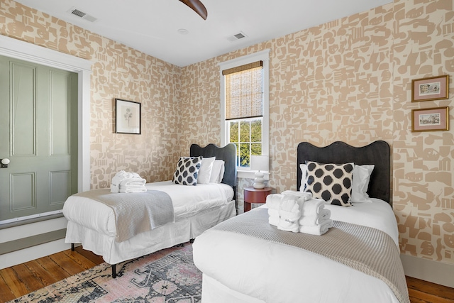 95 Line St, Charleston, SC 29403 - bedroom featuring wood finished floors, visible vents, and wallpapered walls