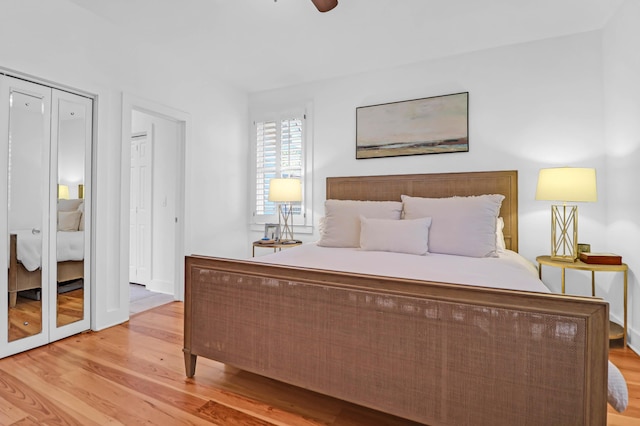 bedroom with light wood-type flooring and ceiling fan