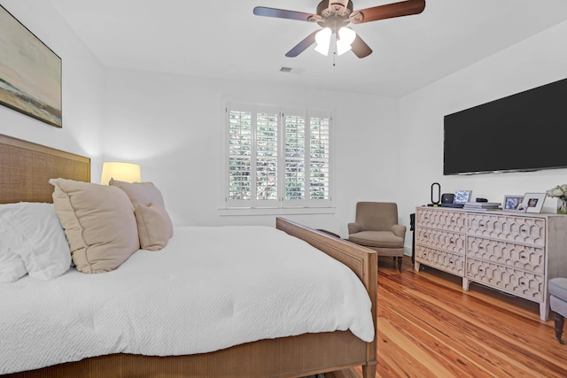 bedroom featuring ceiling fan and light hardwood / wood-style floors