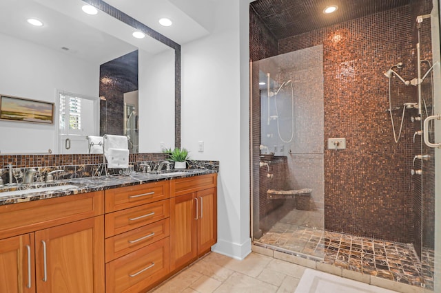 bathroom with vanity and walk in shower