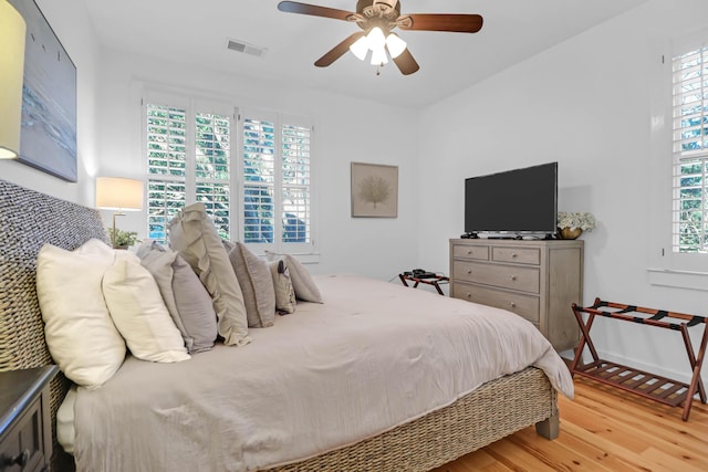 bedroom featuring light hardwood / wood-style flooring and ceiling fan