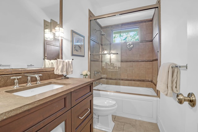 full bathroom featuring combined bath / shower with glass door, vanity, and toilet