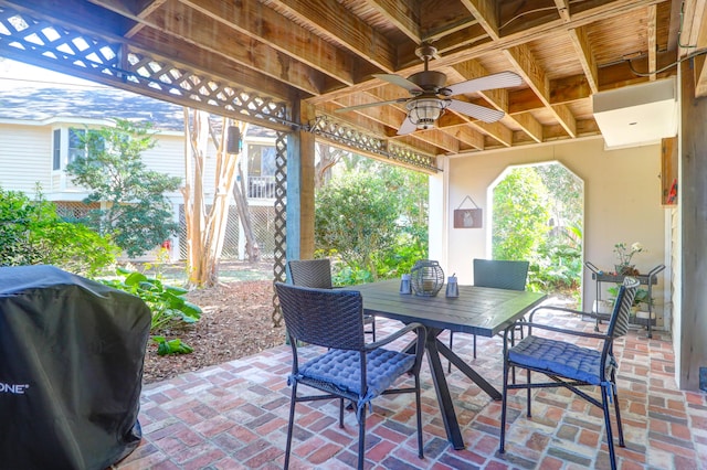 view of patio featuring ceiling fan and a grill