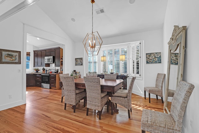 dining space featuring beam ceiling, light hardwood / wood-style flooring, high vaulted ceiling, and a notable chandelier