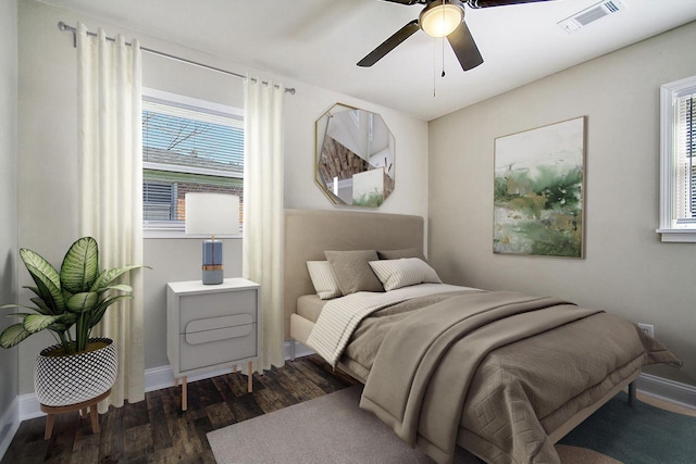 1554 Orange Grove Rd Unit A & B, Charleston, SC 29407 - bedroom with dark wood finished floors, multiple windows, baseboards, and a ceiling fan