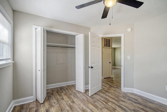 1554 Orange Grove Rd Unit A & B, Charleston, SC 29407 - unfurnished bedroom with multiple windows, a closet, and wood finished floors