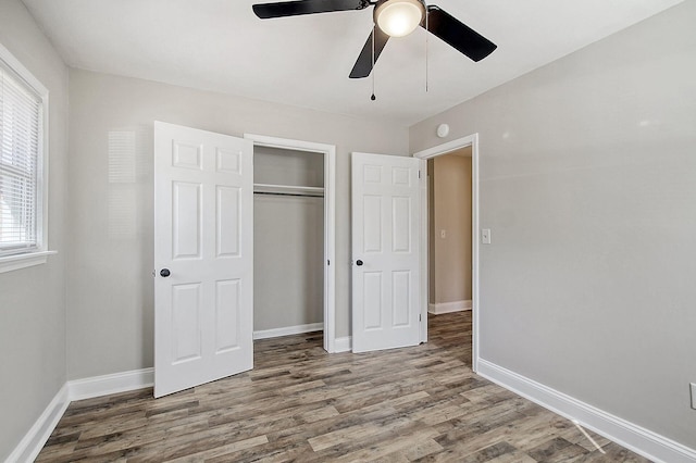 1554 Orange Grove Rd Unit A & B, Charleston, SC 29407 - unfurnished bedroom featuring wood finished floors, a closet, baseboards, and a ceiling fan