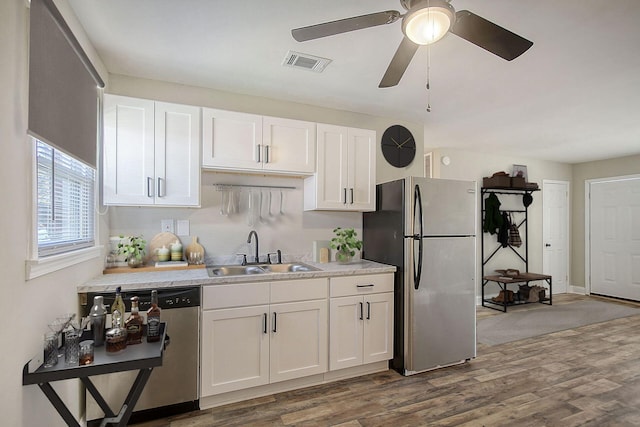 1554 Orange Grove Rd Unit A & B, Charleston, SC 29407 - kitchen with a sink, appliances with stainless steel finishes, white cabinetry, light countertops, and dark wood-style flooring