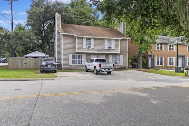 901 Sea Gull Dr Unit A & B, Mount Pleasant, SC 29464 - view of front facade featuring a chimney and uncovered parking