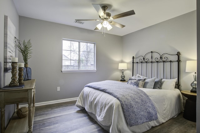 bedroom featuring ceiling fan and dark hardwood / wood-style flooring