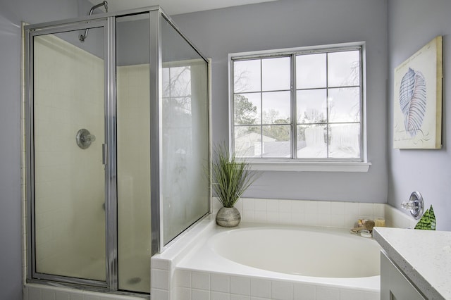 bathroom with plus walk in shower and vanity