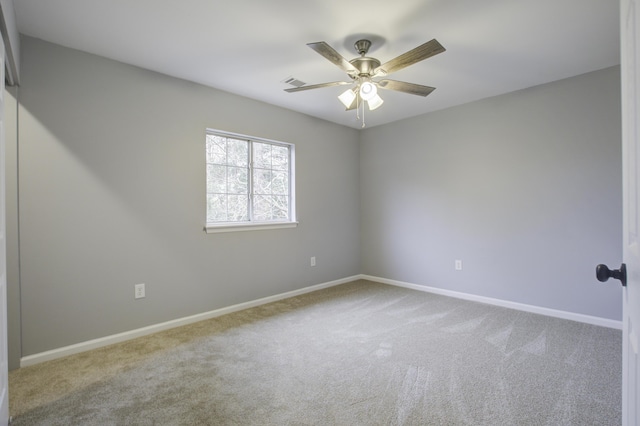 carpeted empty room with ceiling fan