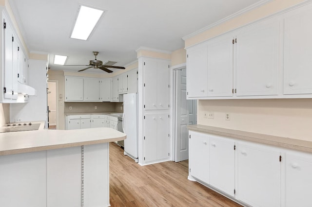 kitchen featuring a ceiling fan, range hood, white cabinetry, light wood-style floors, and crown molding