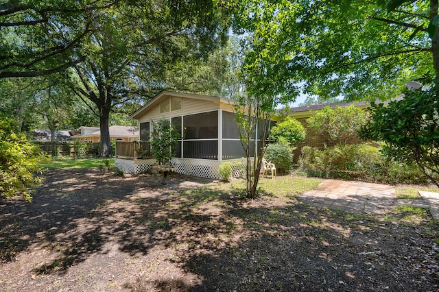 view of yard featuring a sunroom