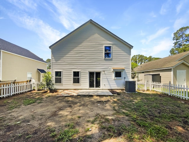back of house with cooling unit, a fenced backyard, and a patio