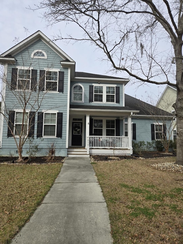 view of front facade with a porch and a front yard