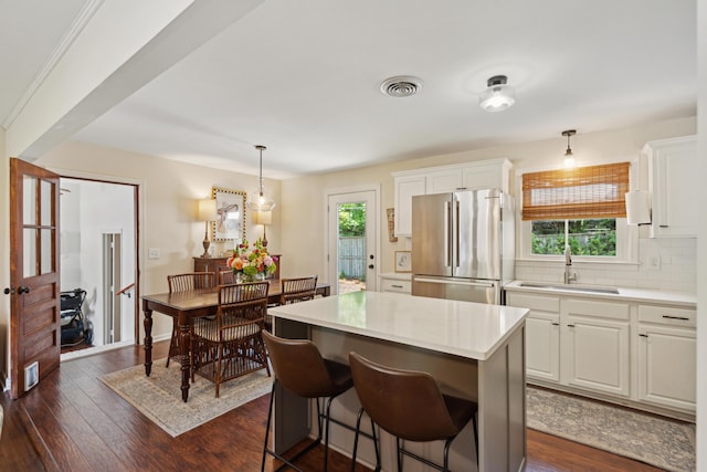 1107 S Shadow Dr, Mount Pleasant, SC 29464 - kitchen featuring freestanding refrigerator, a sink, healthy amount of natural light, and white cabinetry