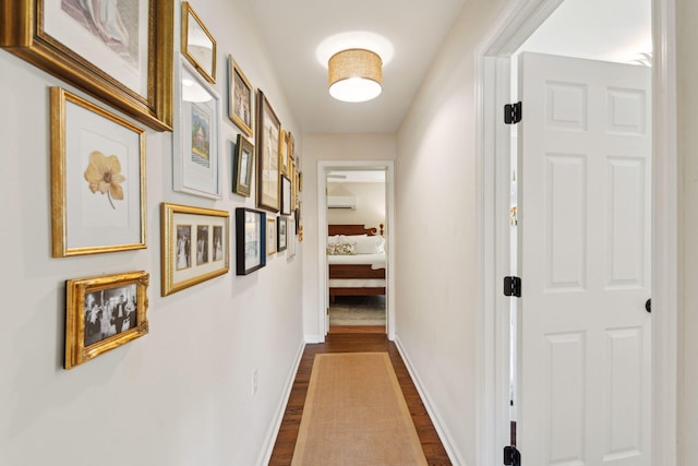 1107 S Shadow Dr, Mount Pleasant, SC 29464 - hallway featuring dark wood-style flooring, baseboards, and a wall unit AC