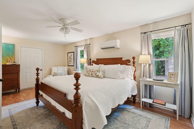 1107 S Shadow Dr, Mount Pleasant, SC 29464 - bedroom featuring a wall unit AC, multiple windows, and wood finished floors