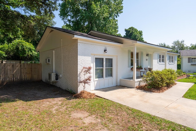 1107 S Shadow Dr, Mount Pleasant, SC 29464 - ranch-style home featuring brick siding, a porch, and ac unit