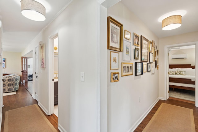 1107 S Shadow Dr, Mount Pleasant, SC 29464 - corridor featuring wood finished floors, an AC wall unit, ornamental molding, and baseboards