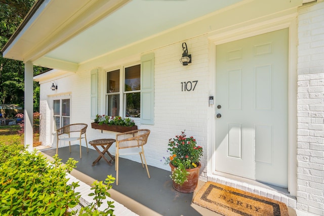 1107 S Shadow Dr, Mount Pleasant, SC 29464 - view of exterior entry featuring a porch and brick siding