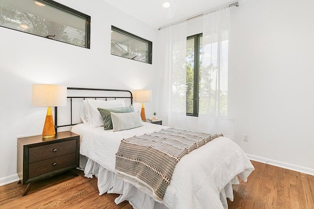 bedroom with hardwood / wood-style flooring