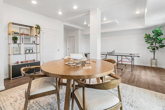 dining space with dark hardwood / wood-style floors