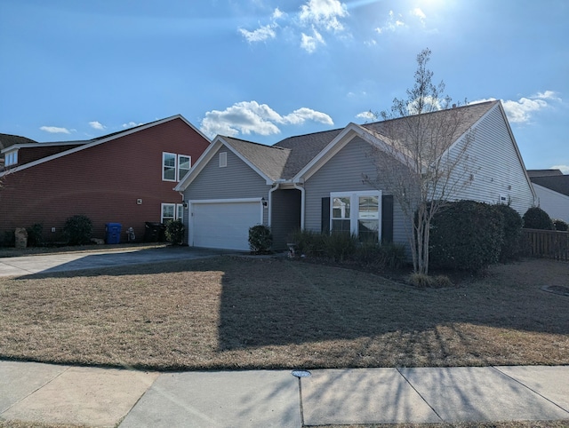 view of front of home featuring a garage and a front lawn