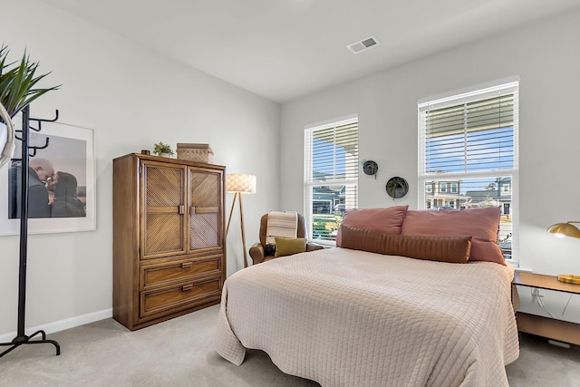 bedroom featuring light colored carpet