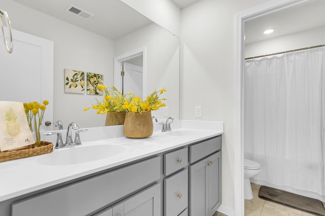 bathroom featuring a shower with curtain, tile patterned flooring, vanity, and toilet