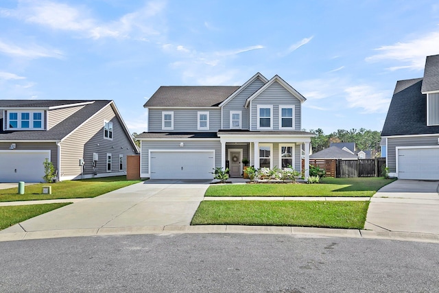 view of front of property with a garage and a front yard