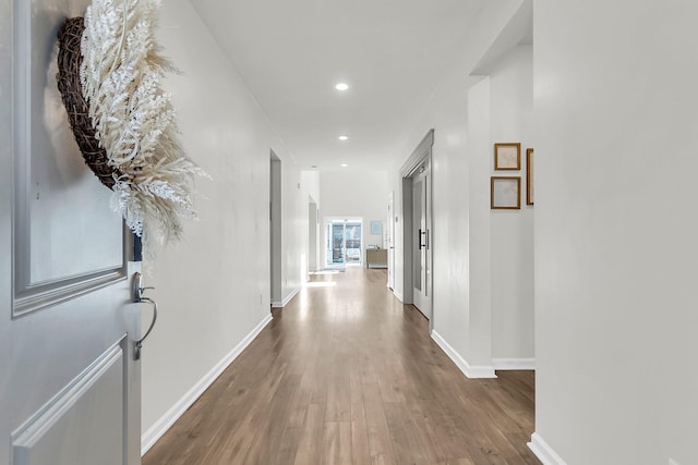 hall with dark hardwood / wood-style floors