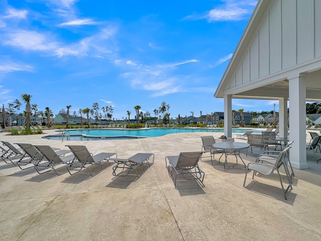 view of swimming pool with a patio