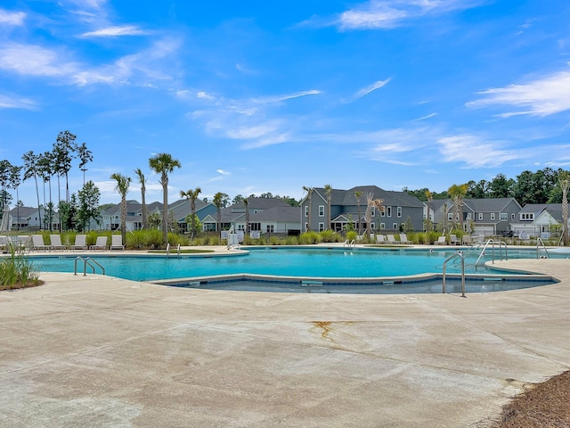 view of swimming pool featuring a patio area