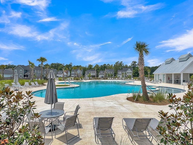 view of swimming pool featuring a patio