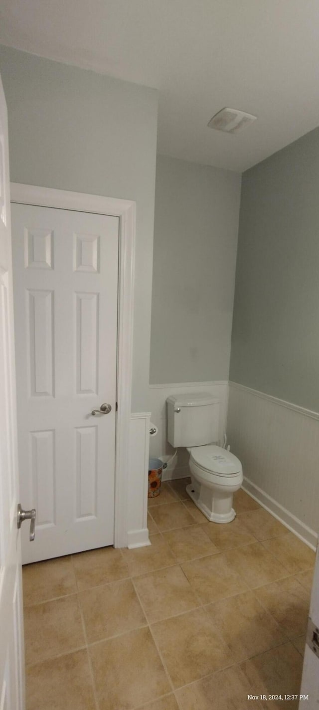 bathroom with tile patterned floors and toilet