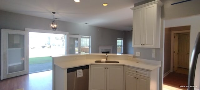 kitchen featuring dishwasher, white cabinets, sink, light hardwood / wood-style flooring, and kitchen peninsula