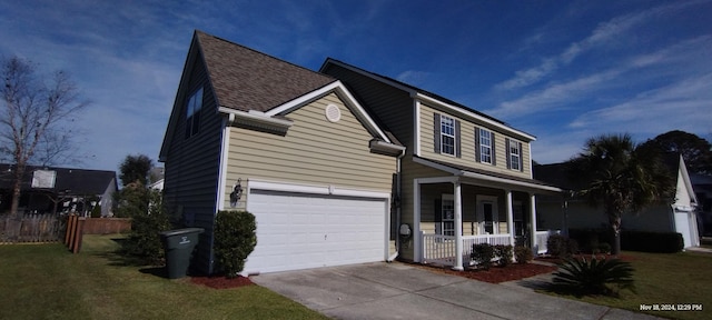 front of property with a front yard, a porch, and a garage