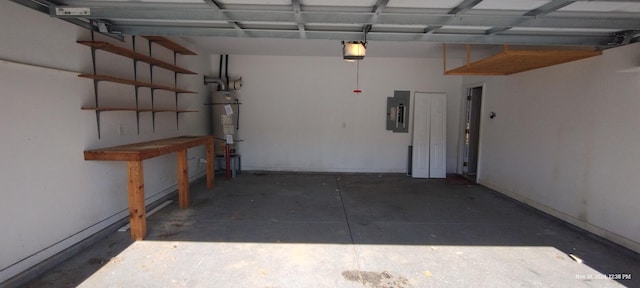 garage featuring electric panel, water heater, and a garage door opener