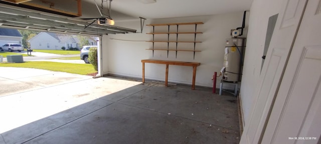 garage with secured water heater and a garage door opener