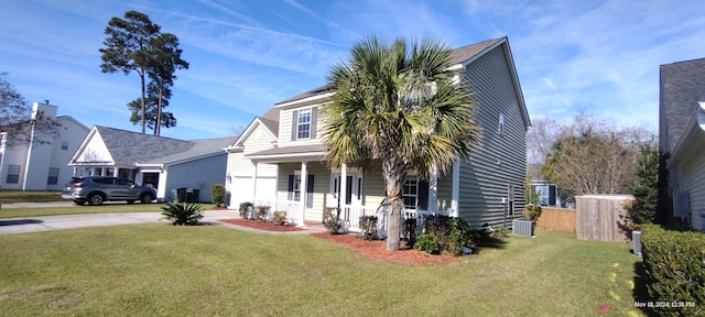 view of front of home featuring covered porch and a front lawn