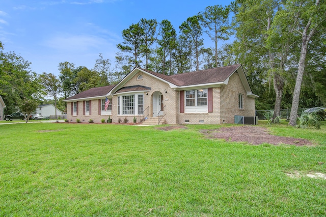 ranch-style house with central air condition unit and a front lawn